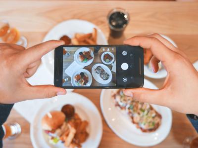 Taking a photo of food with smartphone.