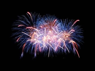 Blue and red fireworks on a black background.