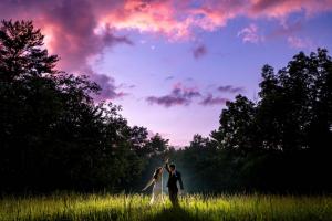 Couple dancing outside after their wedding at Winnebago Springs in Caledonia, MN by La Crosse Photographer Jeff Wiswell of J.L. Wiswell Photography