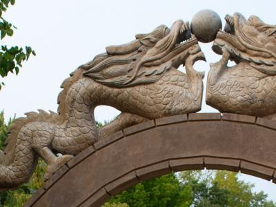 Dragon sculpture on the gate leading into the gardens.