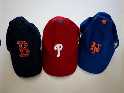 A set of three t-ball caps repeated three times in a row.