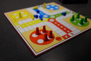 Game board with red, yellow, green, and blue pieces.