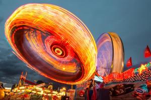Carnival rides with a slow exposure at night.