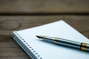 Fountain pen on a spiral notebook.