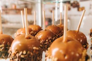 Closeup of caramel apples with nuts.