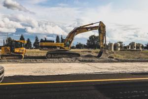 Construction equipment on the side of a road.