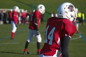 Red jerseys on college football players.